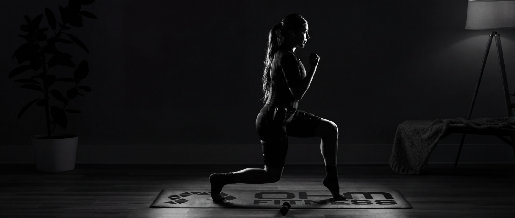 Low-light OHM at-home Pilates session